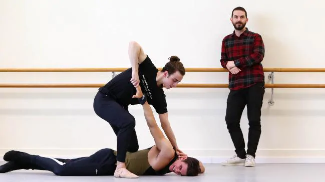 Choreographer Lucas Jervis, right, looks on as Marcus Morielli, top, and Jake Mangakahia rehearse. Picture: Aaron Francis